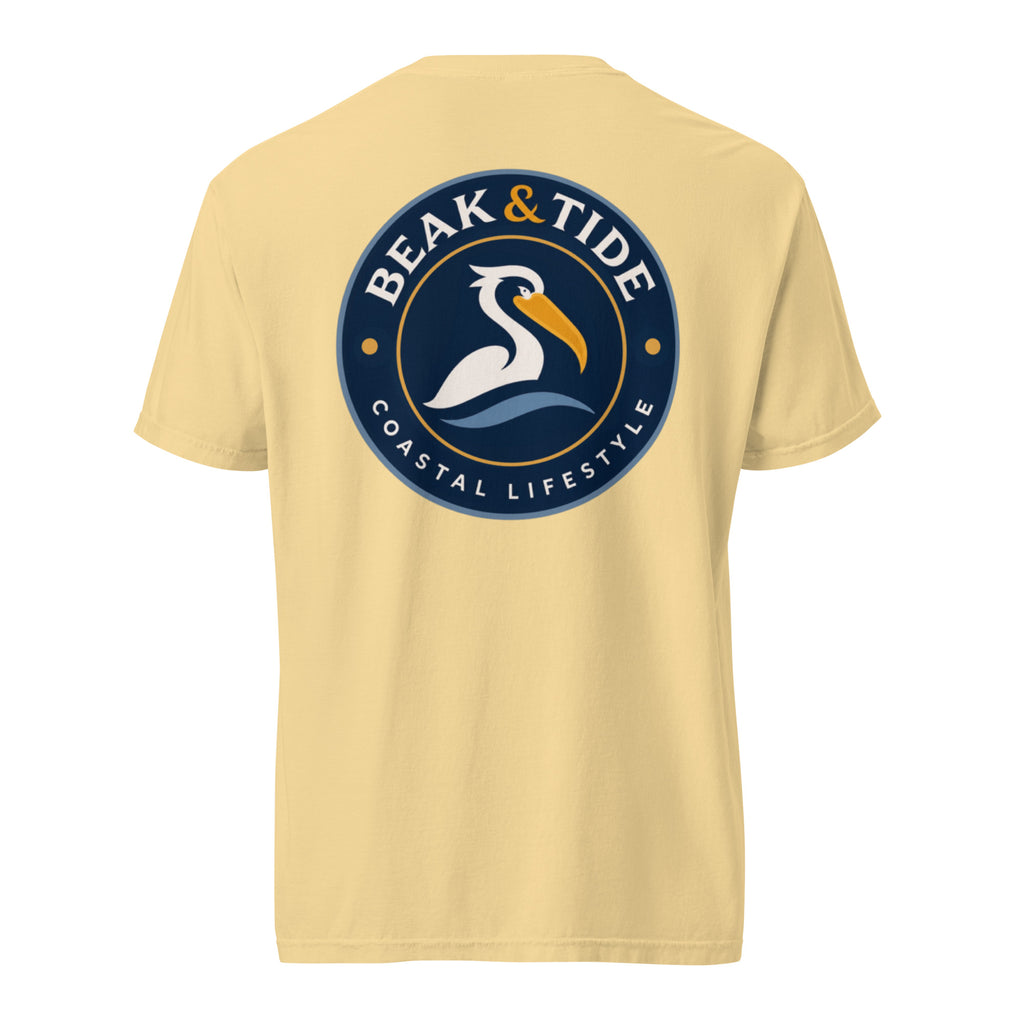 Product mockup of  butter colored t-shirt with a large navy blue Beak & Tide pelican logo on the back.